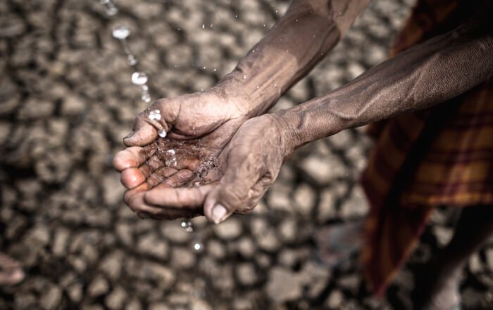 Elderly men are exposed to rainwater in dry weather,global warming,selective focus